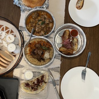 Silk Road Choyhona - From top: Uzbek Tandoori Non Bread, Chahohbili, Plov,   Manti,  Kutabi, Samsa - Salad Near Me - Gaithersburg, Maryland