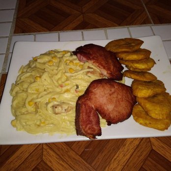 La Chiqui Restaurant - Spaghetti Alfredo, D.R. Style with smoked porkchop & tostones - Dominican Near Me - Bronx, New York