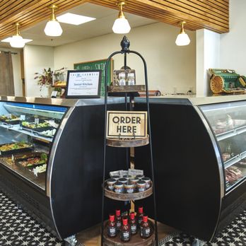 Social Kitchen - a counter with a sign that says order here - American Near Me - Tallahassee, Florida