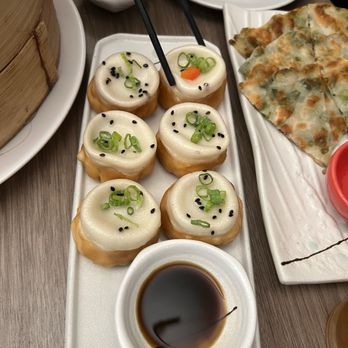 Dumpling Story - Pork Dumpling with Sesame Sauce and Red Chili Oil 6 pc - Asian Fusion Near Me - San Francisco, California Dumpling Story - Pork Dumpling with Sesame Sauce and Red Chili Oil 6 pc - Asian Fusion Near Me - San Francisco, California
