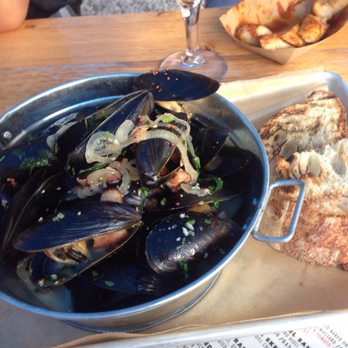 Dacha Beer Garden - Steamed mussels with beer broth, bacon and mustard. You can get it during HH for $9! What a deal! - Beer Gardens Near Me - Washington, DC, District of Columbia