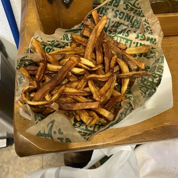 Wingstop - a basket of french fries on a table - Chicken Wings Near Me - Garden Grove, California Wingstop - a basket of french fries on a table - Chicken Wings Near Me - Garden Grove, California