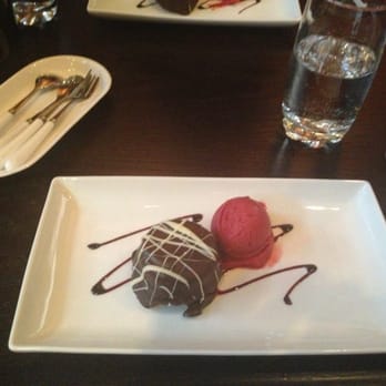 Tzin Wine & Tapas - Flourless chocolate cake and raspberry sorbet - Wine Bars Near Me - Edmonton, Alberta Tzin Wine & Tapas - Flourless chocolate cake and raspberry sorbet - Wine Bars Near Me - Edmonton, Alberta