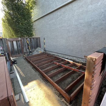 Ryan is Handy - a wooden bed frame laying on the ground - Handyman Near Me