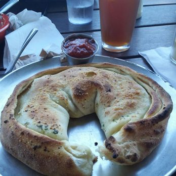 Vic's Pizzeria - Calzone. It was garlicky and cheese goodness - Pizza Near Me - Olympia, Washington