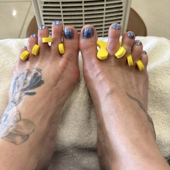 Felton Nails - Two tattooed feet, freshly pedicured at Felton Nails. - Nail Salons Near Me - Felton, California