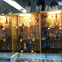 Cigarettes & More - Pretty display of hookah's...