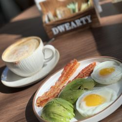 Frida Coffee and Deli - Poached eggs, avocado and bacon.  Cappuccino with almond milk