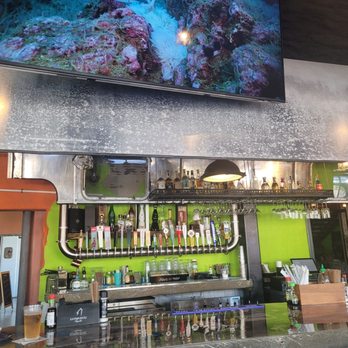 Nomads Canteen - Classic silver bus used as part of the bar. - Beer Bar Near Me - Melbourne, Florida