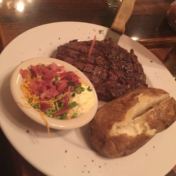 Magic Time Machine - Ribeye with a loaded baked potato - Bars Near Me - Dallas, Texas