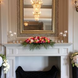 Davinci Flower - Head table arrangement was also used to decorate the mantle in the lobby as a way to save on flowers.