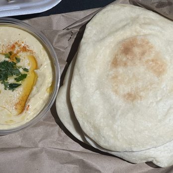 Byblos Restaurant - Hummus: Puree of chickpeas w/right touch of tahini, fresh lemon juice, & garlic. Comes with pita - Lebanese Near Me - Gainesville, Virginia Byblos Restaurant - Hummus: Puree of chickpeas w/right touch of tahini, fresh lemon juice, & garlic. Comes with pita - Lebanese Near Me - Gainesville, Virginia