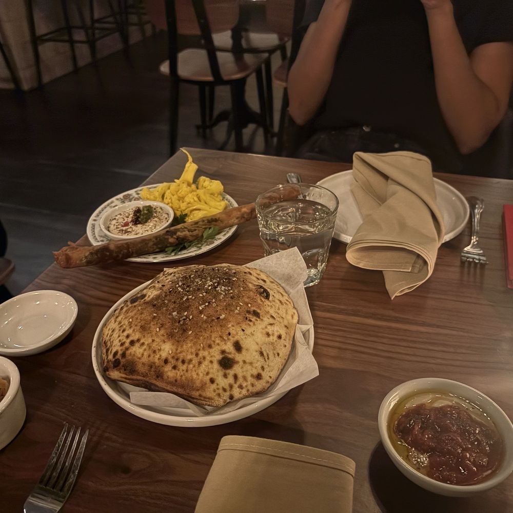 Carmel - Moroccan Frena bread, olives, your grandma's cigar and cauliflower - Mediterranean Near Me - Los Angeles, California Carmel - Moroccan Frena bread, olives, your grandma's cigar and cauliflower - Mediterranean Near Me - Los Angeles, California