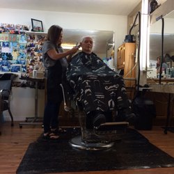 HWY 69 BARBER SHOP - Selina cutting a Retired Colorado State Trooper.