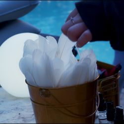 Stillwater Symphony - A client choosing a feather to add essential oils to before a float.