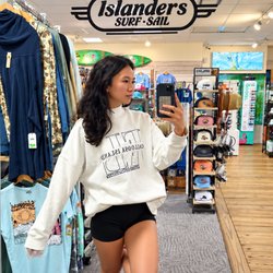 Islanders Coastal Outfitter - Add another must-have color to your wardrobe at Islanders Surf & Sail. This cream oversized graphic sweatshirt offers a relax...