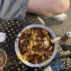 Meltdown Bistro - Loaded tater tots with added birria at the bench in front of the truck. Friday evening at gazebo gardens