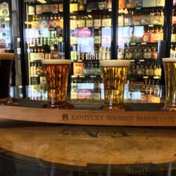 Shenanigan's Wine and Spirits - From right to left: Peach Wheat, IPA, Bourbon Barrel Ale and Stout (the last two aged in bourbon barrels). By Alltech