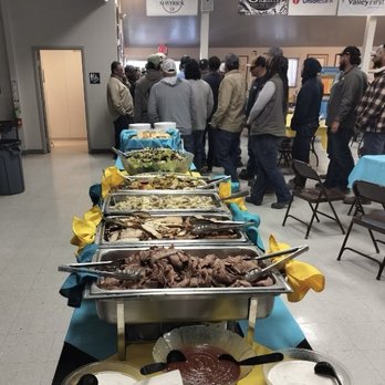 Clovis Rodeo - Buffet line with tri-tip, chicken, grilled vegetables, and Parmesan, roasted potatoes with barbecue sauce and creamy horseradish - Rodeo Near Me - Clovis, California