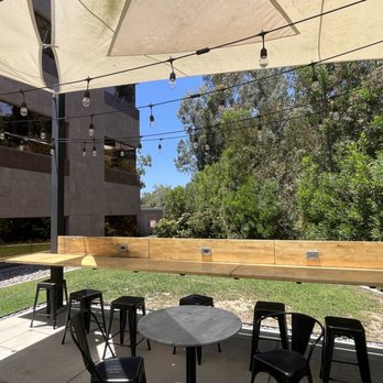 Downtown Works Carlsbad - Outside seating area with areas to charge your laptop - Shared Office Spaces Near Me - Carlsbad, California Downtown Works Carlsbad - Outside seating area with areas to charge your laptop - Shared Office Spaces Near Me - Carlsbad, California