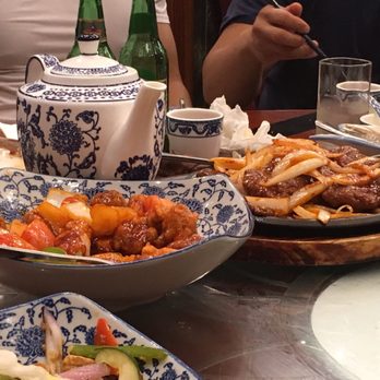 Congee Village - Chicken , steak and tea in background - Cantonese Near Me - Flushing, New York Congee Village - Chicken , steak and tea in background - Cantonese Near Me - Flushing, New York