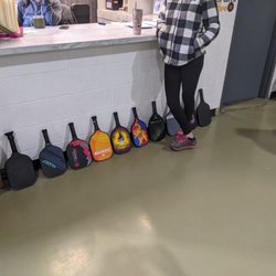 YMCA Sports Center - Photo of players paddles queued and waiting for an open court.