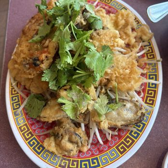 Siam Sunset - fried mussels omelette over bean sprouts - Thai Near Me - Los Angeles, California Siam Sunset - fried mussels omelette over bean sprouts - Thai Near Me - Los Angeles, California
