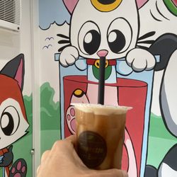 Drinking milk tea with all my friends.