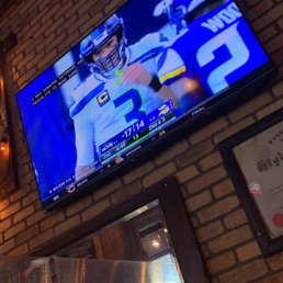 a television on a brick wall a television on a brick wall