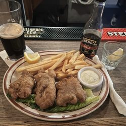 Fish and chips with a Guinness, malt vinegar and lemon
