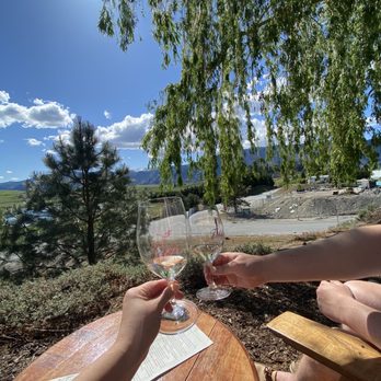 Tildio Winery - two people toasting with wine glasses - Wineries Near Me - Manson, Washington Tildio Winery - two people toasting with wine glasses - Wineries Near Me - Manson, Washington