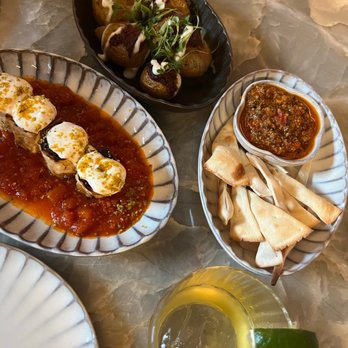Ammoora - Beyti Sujuk rolls, Smasher Batata Harra, complimentary pita chips and house tabouleh (which was so delicious), and Wild West Wind Cocktail. - Mediterranean Near Me - Baltimore, Maryland Ammoora - Beyti Sujuk rolls, Smasher Batata Harra, complimentary pita chips and house tabouleh (which was so delicious), and Wild West Wind Cocktail. - Mediterranean Near Me - Baltimore, Maryland