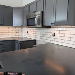 Yellow Dog Enterprises - Tile installed in a new kitchen.