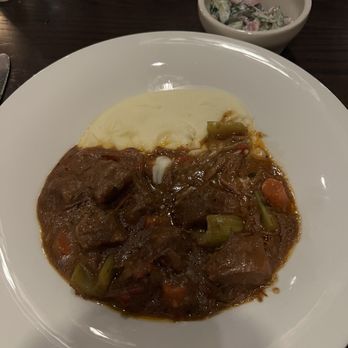 Adelle's - Goulash with mashed potatoes and cucumber salad. - American Near Me - Wheaton, Illinois
