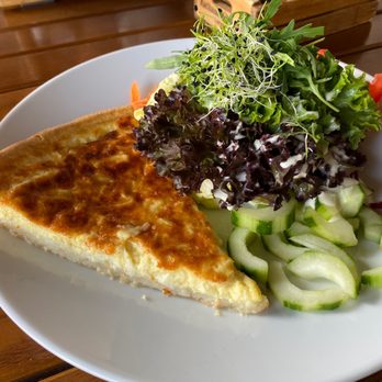 Rathaus Brauerei - "Lucerne cheesecake": vegetarian quiche with Gruyère and Sbrinz, served with side salad - Breweries Near Me - Luzern, LU Rathaus Brauerei - "Lucerne cheesecake": vegetarian quiche with Gruyère and Sbrinz, served with side salad - Breweries Near Me - Luzern, LU