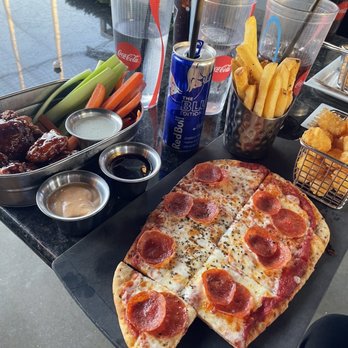 Topgolf - BBQ Boneless wings with ranch/BBQ sauce/Aioli sauce, fries, blueberry Redbull, tatertots, pepperoni flatbread - New American Near Me - San Antonio, Texas Topgolf - BBQ Boneless wings with ranch/BBQ sauce/Aioli sauce, fries, blueberry Redbull, tatertots, pepperoni flatbread - New American Near Me - San Antonio, Texas