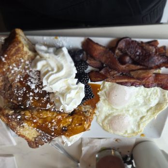 Toasted Gastrobrunch - Stuffed French toast over easy eggs and bacon  5/5 berries were soo fresh and delicious - Breakfast & Brunch Near Me - Oceanside, California