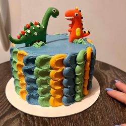 Naughty and Nice cakes by Opal - Marble smash cake with buttercream frosting Dino style