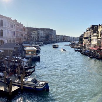 Canal Grande - Afternoon view of the Grand Canal (Canal Grande) from Rialto Bridge (Ponte di Rialto) with the Vaporetto (water bus) stop on the left - Landmarks & Historical Buildings Near Me
