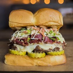 THE MENSCH - white american cheese, pickles, pastrami, haus slaw, secret sauce