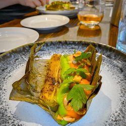 Twelve Plants At Root - Leek cooked in banana leaf with parsley emulsion, bell pepper couli and toasted hazelnut