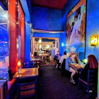 La Vita E Bella - The corridor to the more formal dining area, with a handful of casual eating tables - Italian Near Me - Seattle, Washington