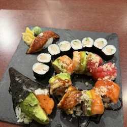Sushi Ko Japanese Restaurant - Left to right, spicy salmon hand roll, unagi, negi-hamachi roll, paradise roll. Yum!