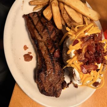 Texas Roadhouse - Steak with loaded potato and fries - Steakhouses Near Me - Bloomington, Indiana