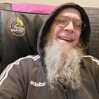 Juicy Bone - a man with a long beard and glasses - New American Near Me - Beaverton, Michigan