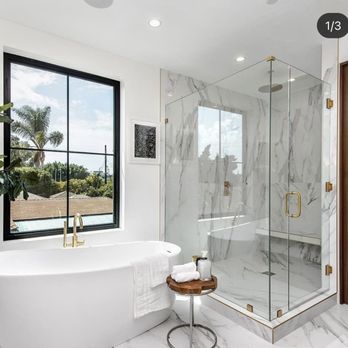 Silicon Construction & Remodeling - a bathroom with a large glass shower - Flooring Near Me - San Jose , California Silicon Construction & Remodeling - a bathroom with a large glass shower - Flooring Near Me - San Jose , California