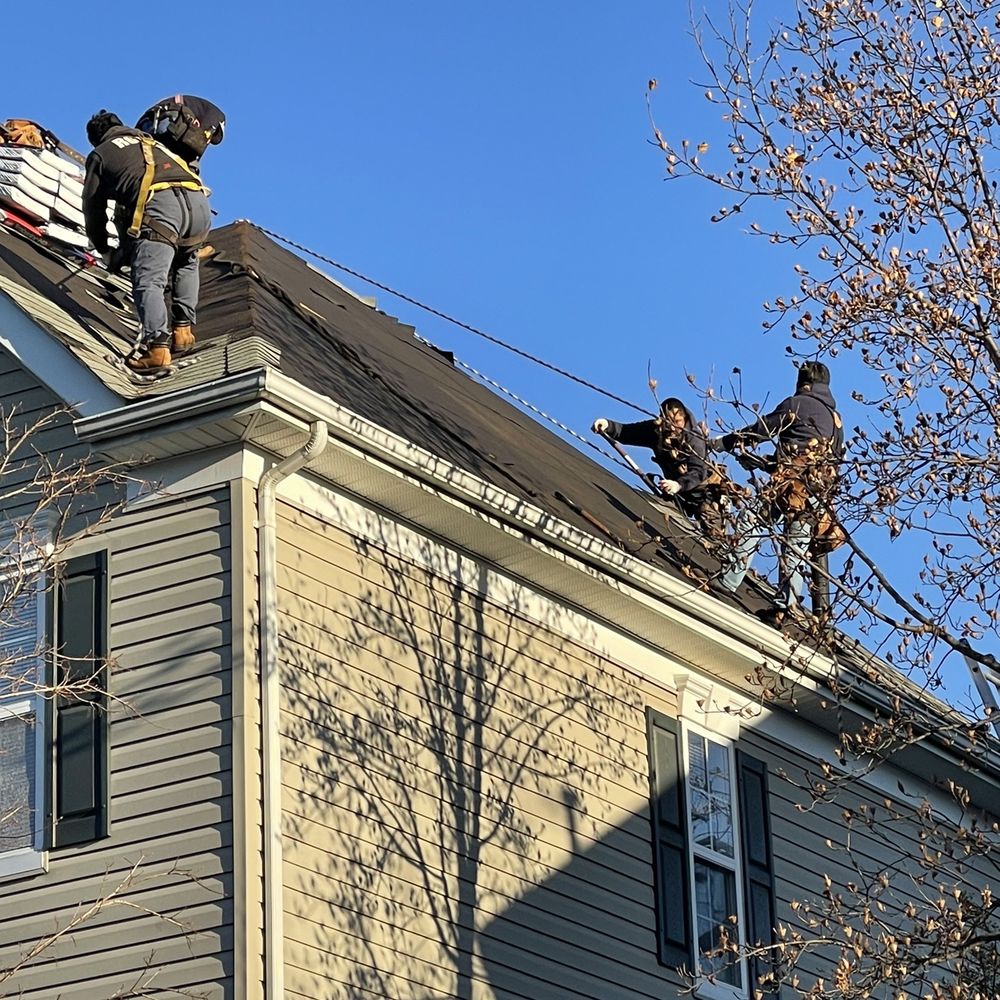 Roofer 911 - Harnessed workers during the install. - Roofing Near Me