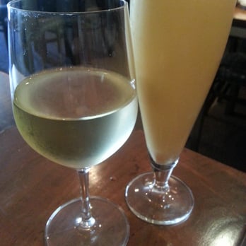 Himalayan Sherpa Kitchen - Glass of white wine for me and a fresh mango lassi for the birthday mom - Himalayan/Nepalese Near Me - St. Helena, California