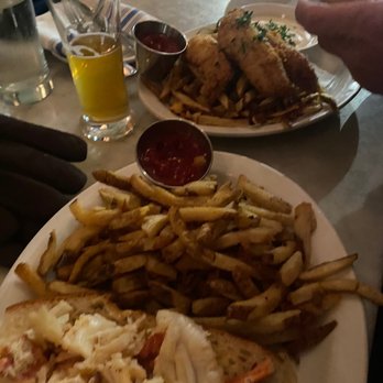 Neptune Oyster - Hot lobster roll and fries and the fish and chips - Seafood Near Me - Boston, Massachusetts