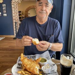 Eating English style fish and chips.